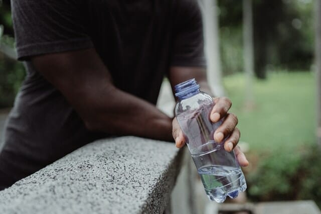 photo-of-person-holding-clear-plastic-bottle-4720245