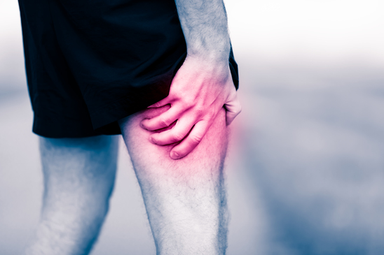photodune-13629811-leg-pain-man-holding-sore-and-painful-muscle-xs