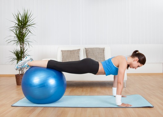 photodune-3008664-woman-exercising-with-exercise-ball-xs