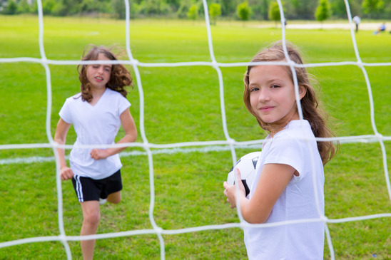 photodune-4909851-soccer-football-kid-girls-playing-on-field-xs