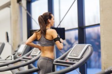 photodune-9922017-woman-with-earphones-exercising-on-treadmill-xs-230x153